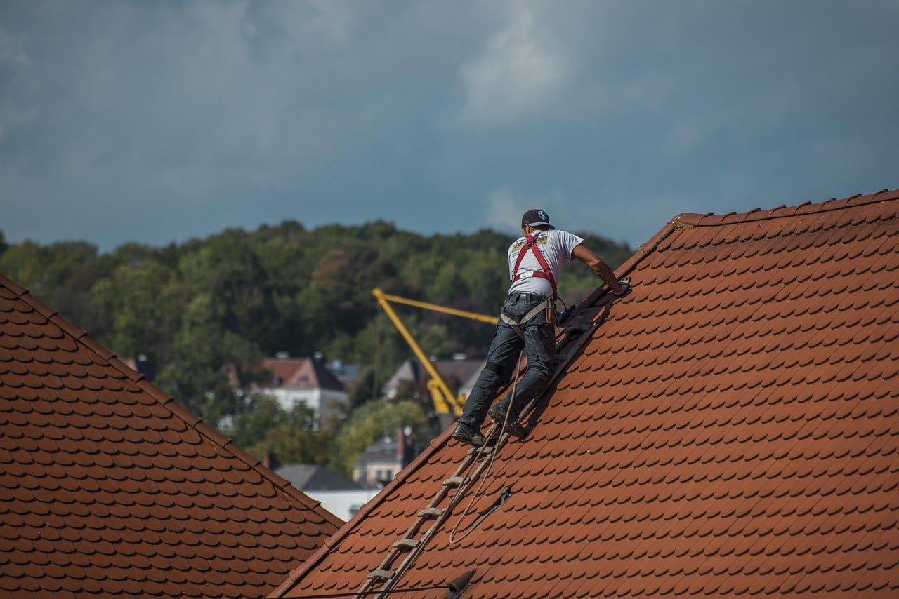 man working on a roof